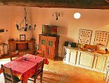 Die Wohnküche mit Kamin Die Wohnküche mit Kamin und Zugang zur Terrasse